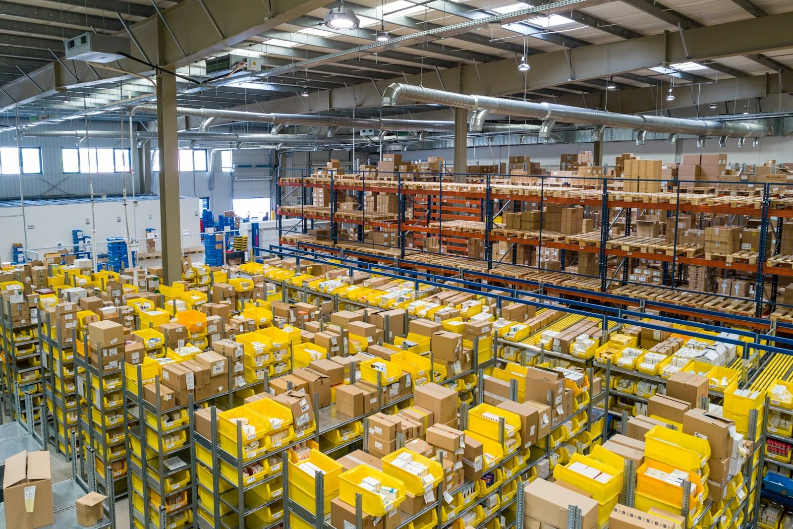 Large warehouse interior filled with stacked boxes and shelving
