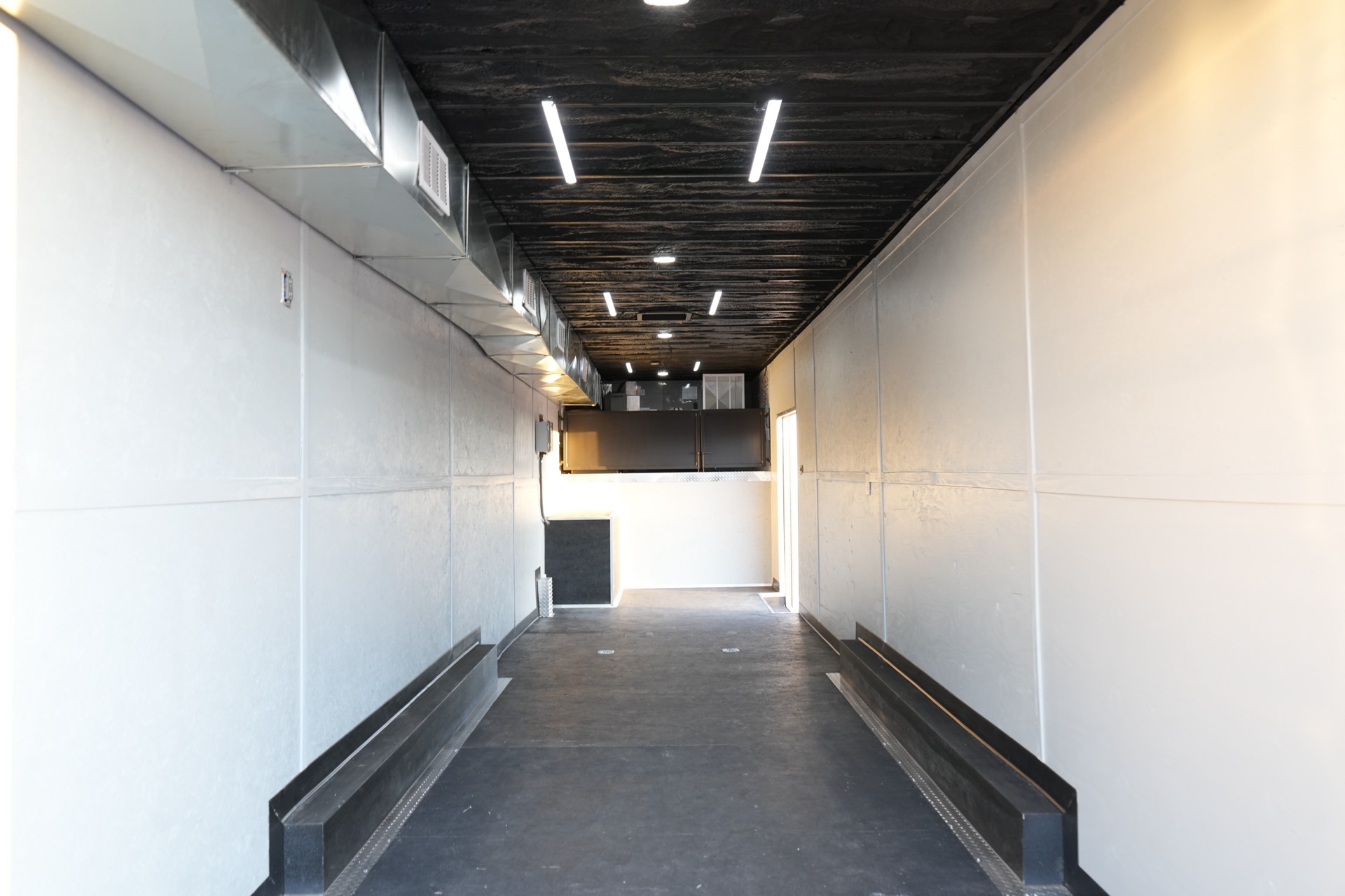 Climate-controlled interior with closed-cell spray foam insulation, dual mini-split heads, and LED lighting